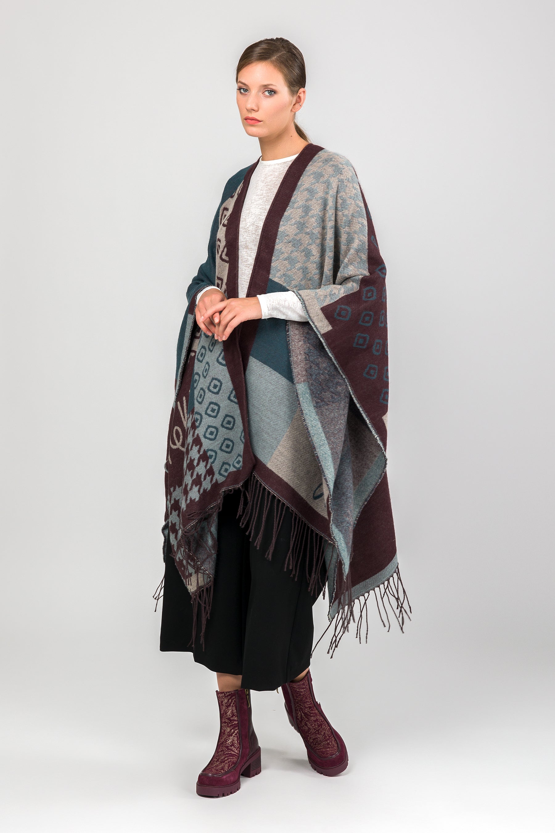Poncho à franges bleu pétrole et beige