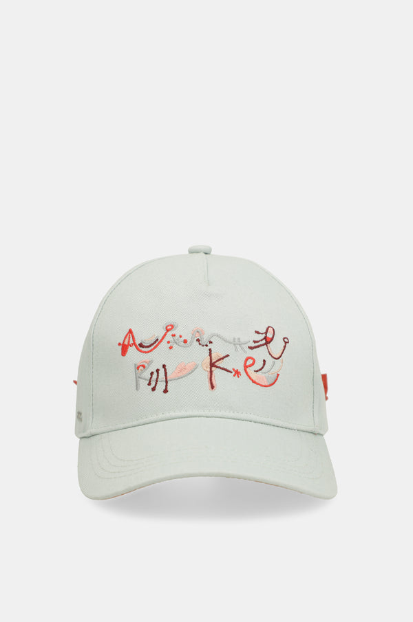 Casquette verte avec nœud rouge