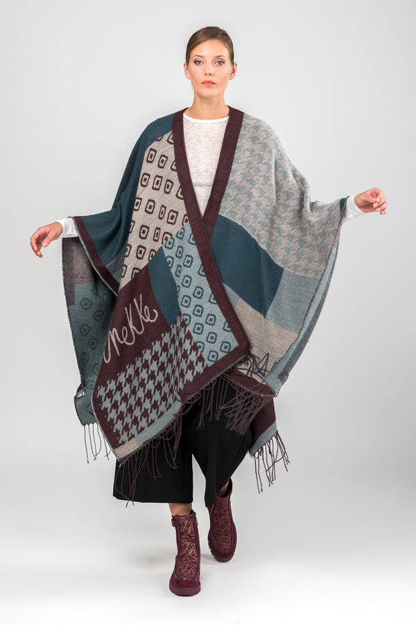 Poncho à franges bleu pétrole et beige