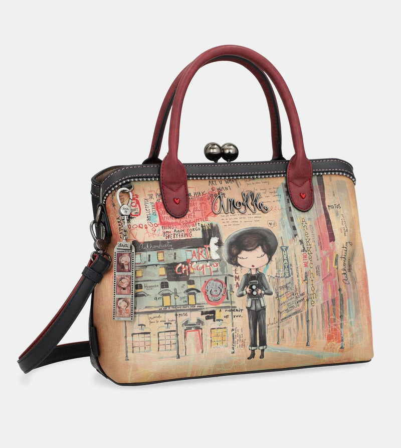 Sac à main de l'art de la ville avec une fermeture de serrure de baiser