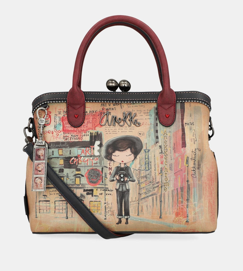 Sac à main de l'art de la ville avec une fermeture de serrure de baiser