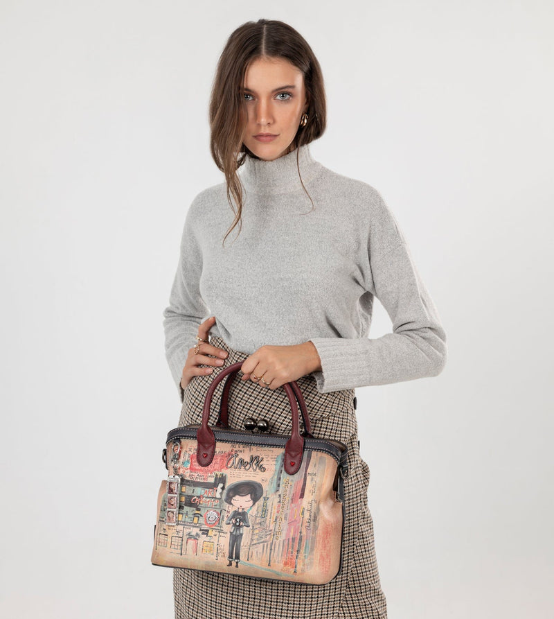 Sac à main de l'art de la ville avec une fermeture de serrure de baiser