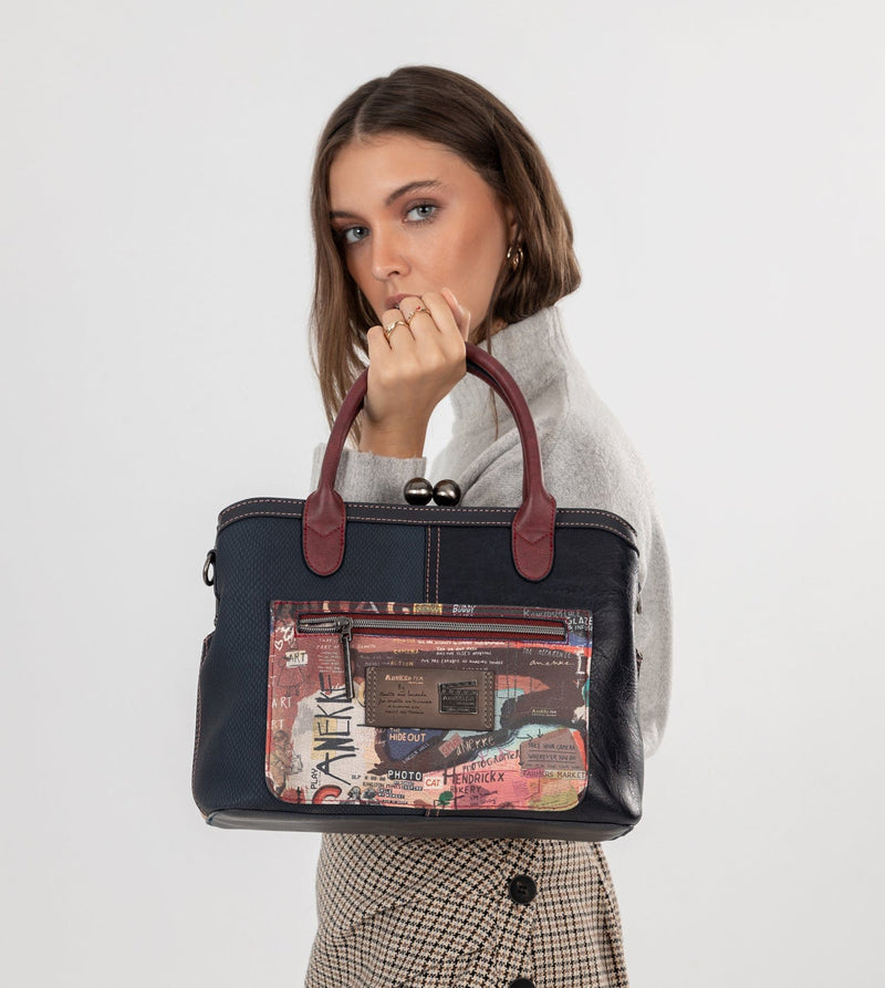 Sac à main de l'art de la ville avec une fermeture de serrure de baiser